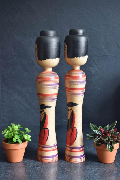 Zenji Sato kokeshi pair showcasing side profile and body details
