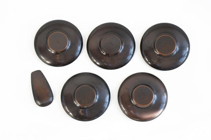 Shochikubai Hammered Copper Chataku Tea Set underside view of five round copper saucers and a tea scoop