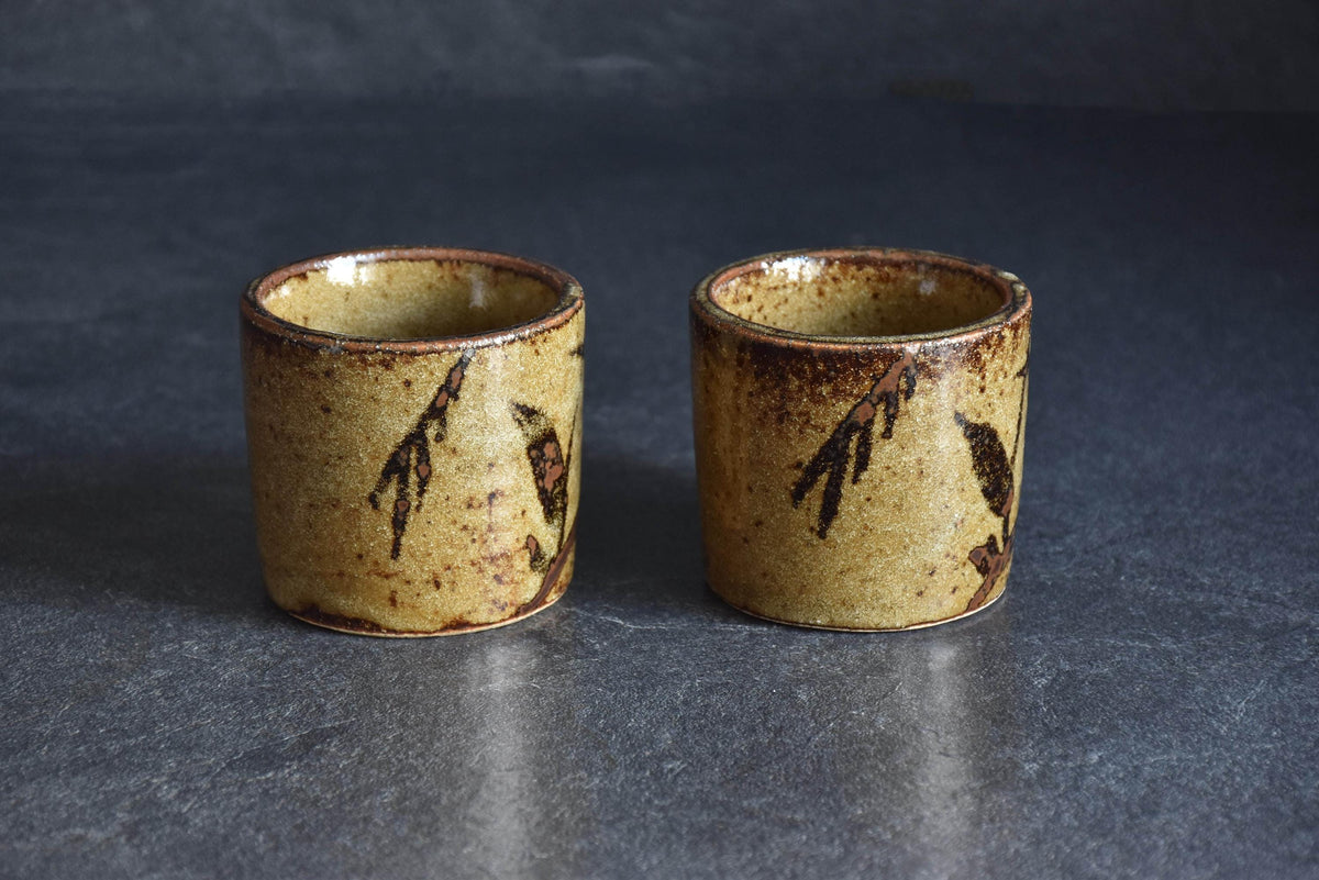 Karatsu-yaki coffee cups highlighting hand-painted iron-brown branch patterns