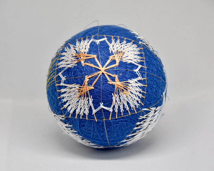 Hand-Embroidered Japanese Temari Ball Folk Art showing top view of the embroidered geometric pattern