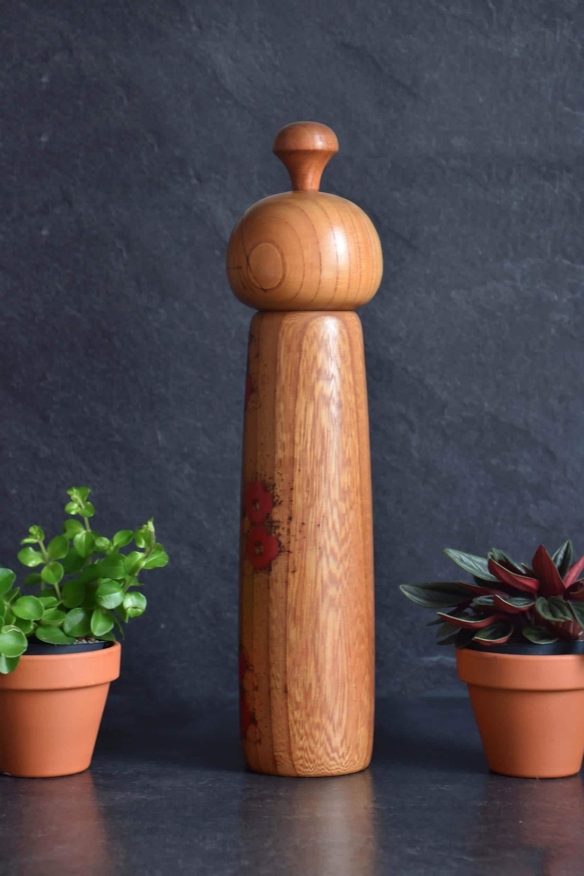 Toa Sekiguchi kokeshi doll back view showing the natural wood grain and shape