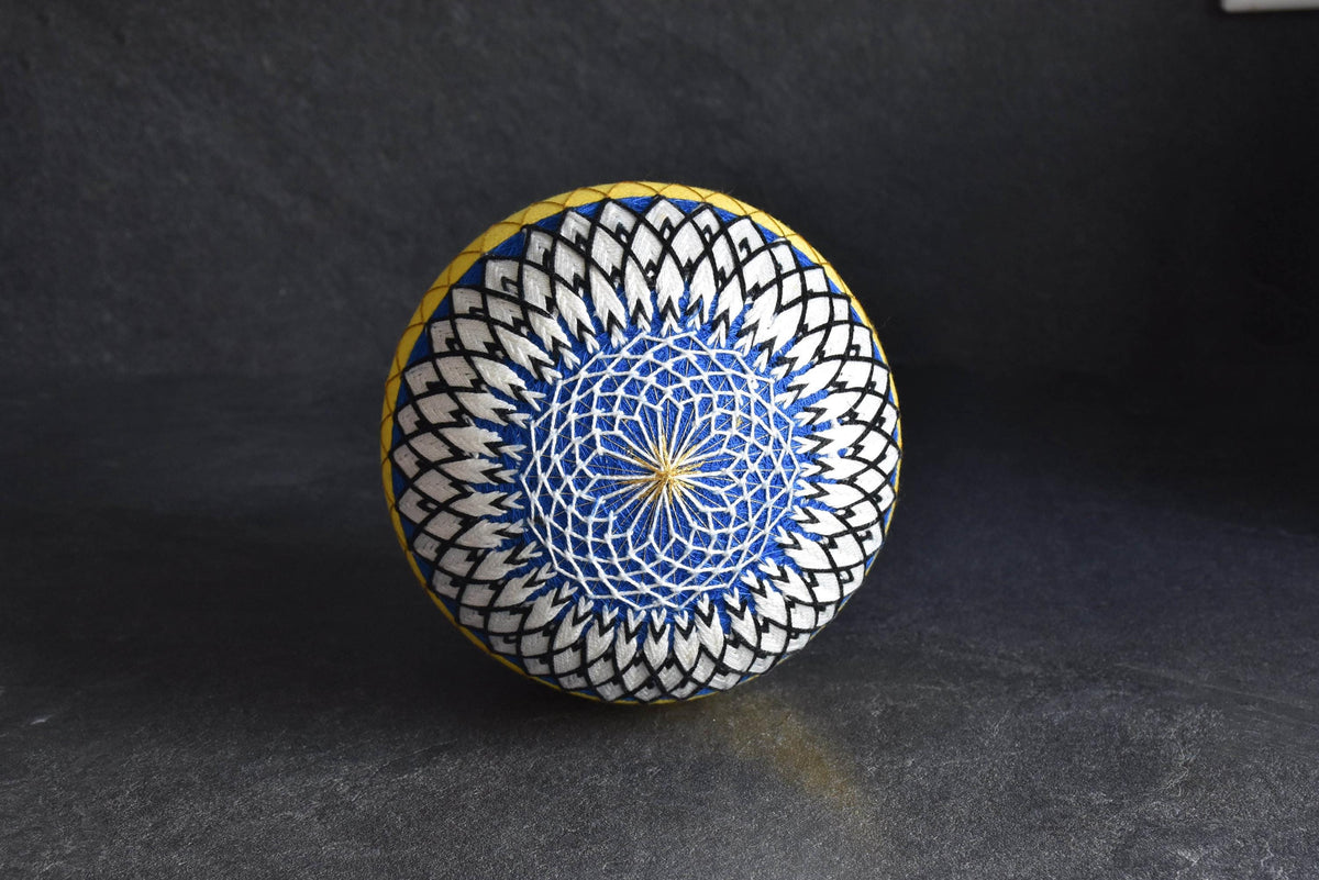 Geometric Black And White Embroidered Temari Ball showing intricate circular pattern detail