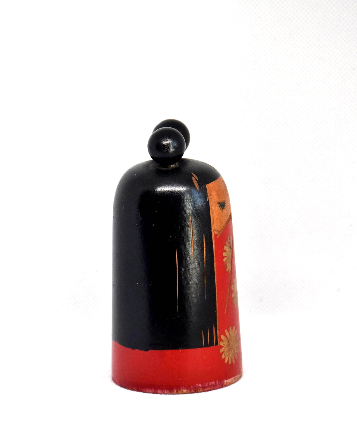 Japanese Kokeshi Doll With Black Ribbon showing the side view with black painted hair