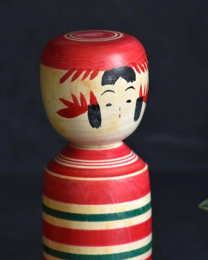 Teizo Hiraga Sakunami kokeshi doll close up on head and facial features with painted hair