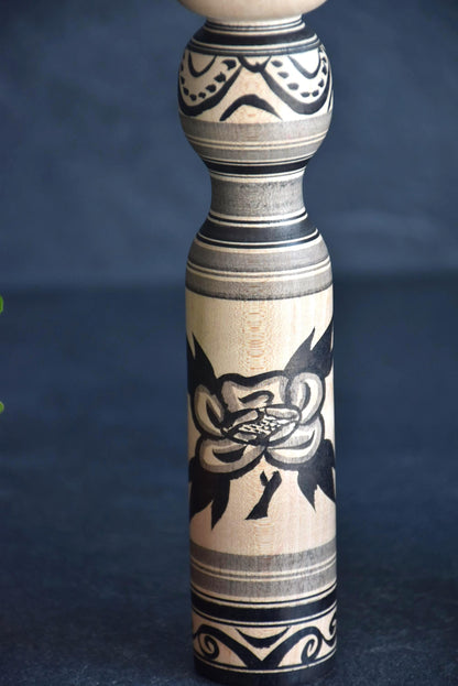 Zenji Sato kokeshi doll close-up of the floral motif and horizontal Rokuro Moyo stripes