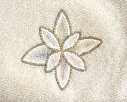 Vintage Japanese beaded clutch handbag detail of the single small floral motif on the reverse side