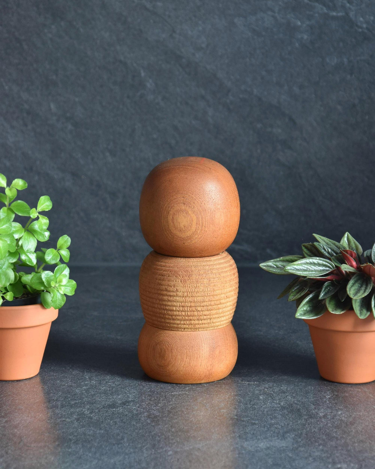 Aida Seihou kokeshi doll viewed from another angle showing natural wood grain patterns