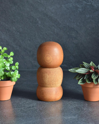 Aida Seihou kokeshi doll viewed from another angle showing natural wood grain patterns