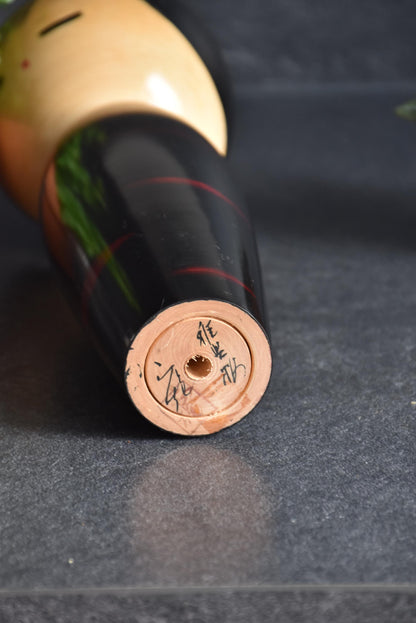 Masao Watanabe creative kokeshi doll base showing the artisan signature and stamp