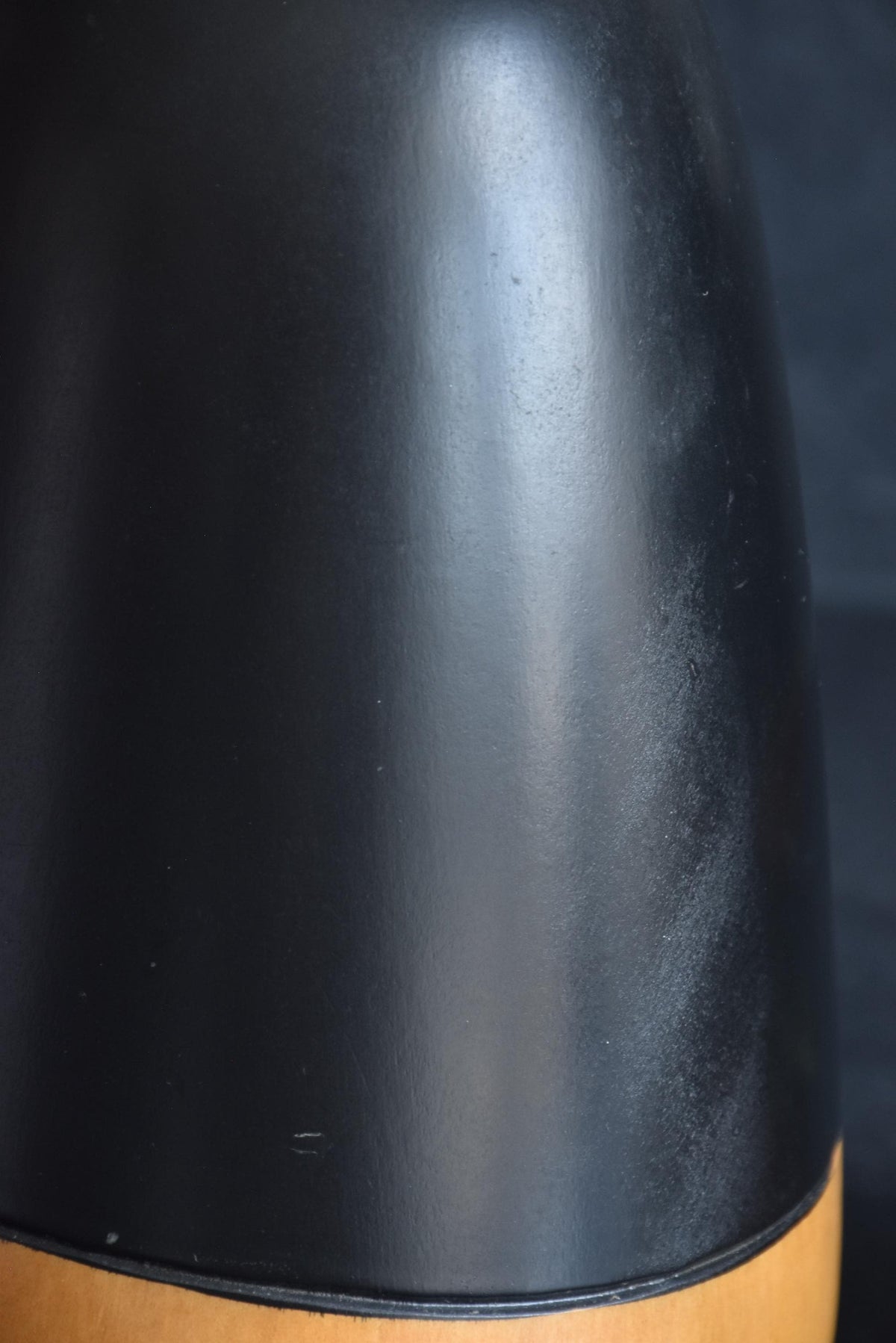 Close-up texture and surface condition of the dark painted section on Ishimura Sosaku kokeshi