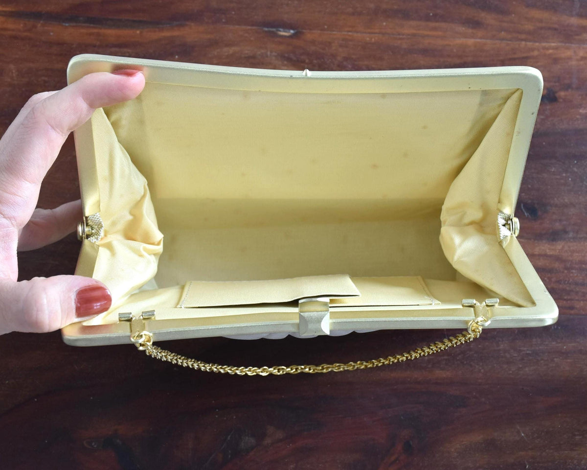 Japanese Brocade Clutch Bag With Metallic Thread Motifs showing the inside with cream satin lining and small pocket