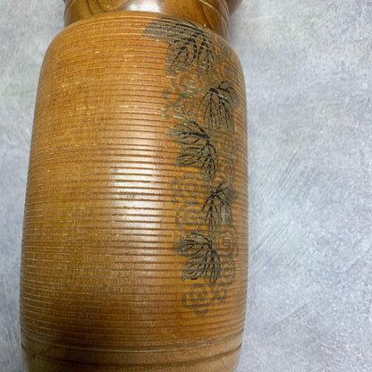 Sato Suigai kokeshi close up of the stilt grass etching on the wood body