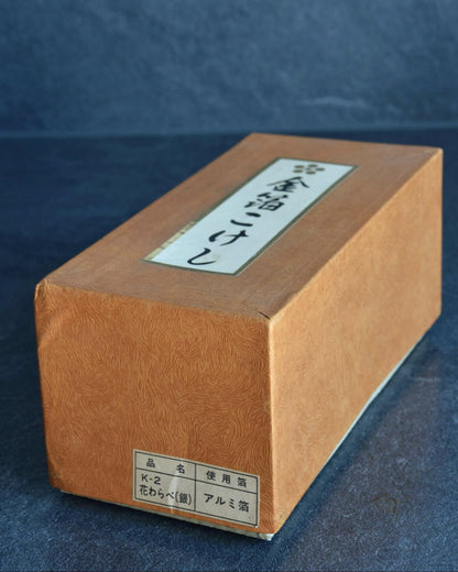 Hanawarabe kokeshi original cardboard box with product classification labels attached