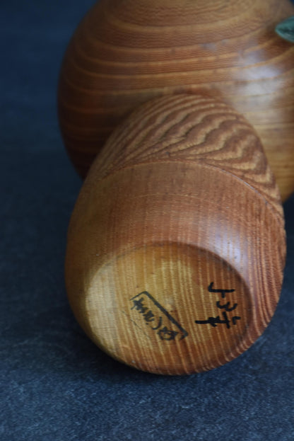 Takeda Masashi kokeshi doll base showing artist signature and brushwork