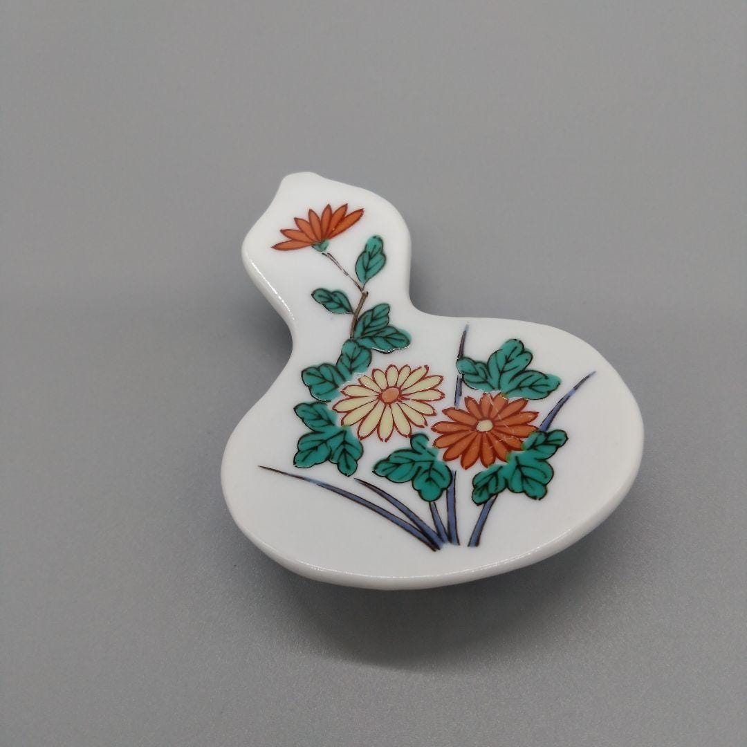 Floral Gourd Porcelain Chopstick Rest single piece viewed closely from the front