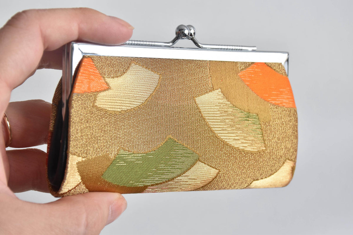 Nishijin-Ori Silk Gamaguchi Coin Purse held in a hand
