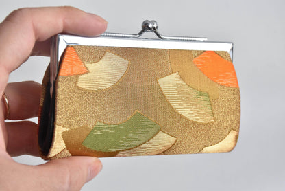 Nishijin-Ori Silk Gamaguchi Coin Purse held in a hand