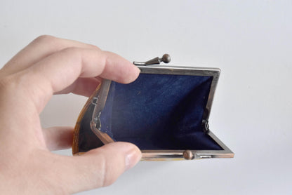 Oshima Tsumugi Silk Gamaguchi Coin Purse opened to show the dark blue lining inside the metal clasp frame