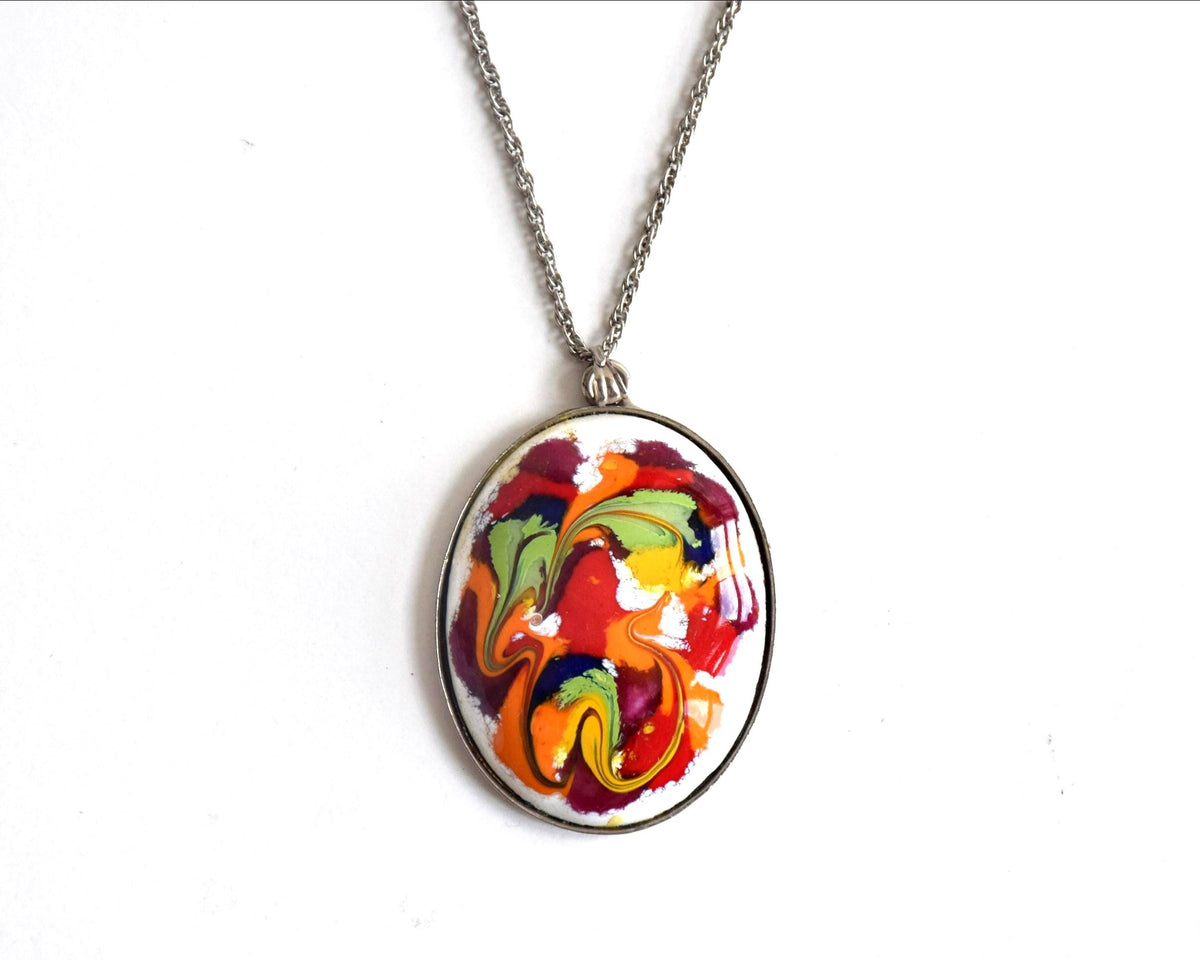 Japanese Enamel Pendant Necklace Abstract Swirl with vibrant red and orange pattern on a silver-tone chain