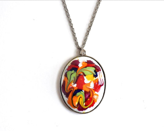 Japanese Enamel Pendant Necklace Abstract Swirl with vibrant red and orange pattern on a silver-tone chain