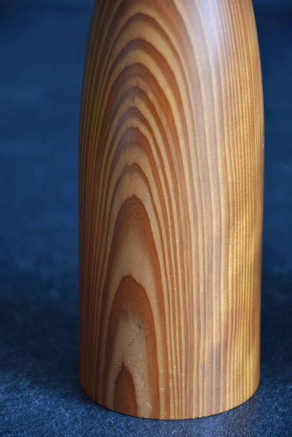 Sosaku Kokeshi doll in Yakusugi cedar wood showing the wood grain pattern detail