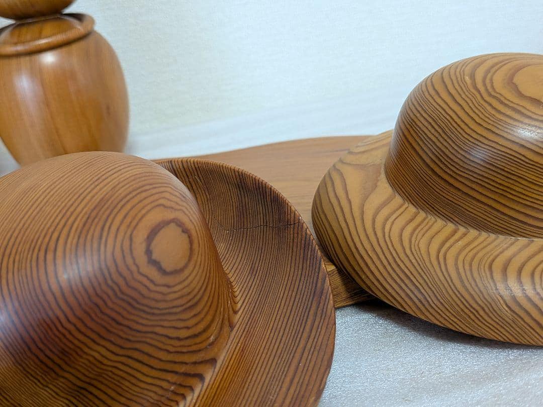 Yakusugi Cedar Sosaku Kokeshi Hat close up displaying a small hairline crack on the brim