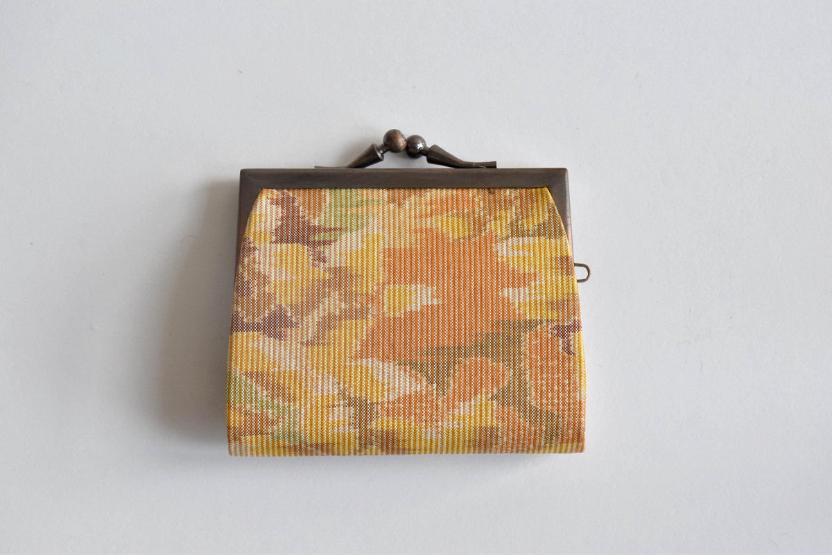 Oshima Tsumugi Silk Gamaguchi Coin Purse showing the textured pattern detail on the mud-dyed fabric