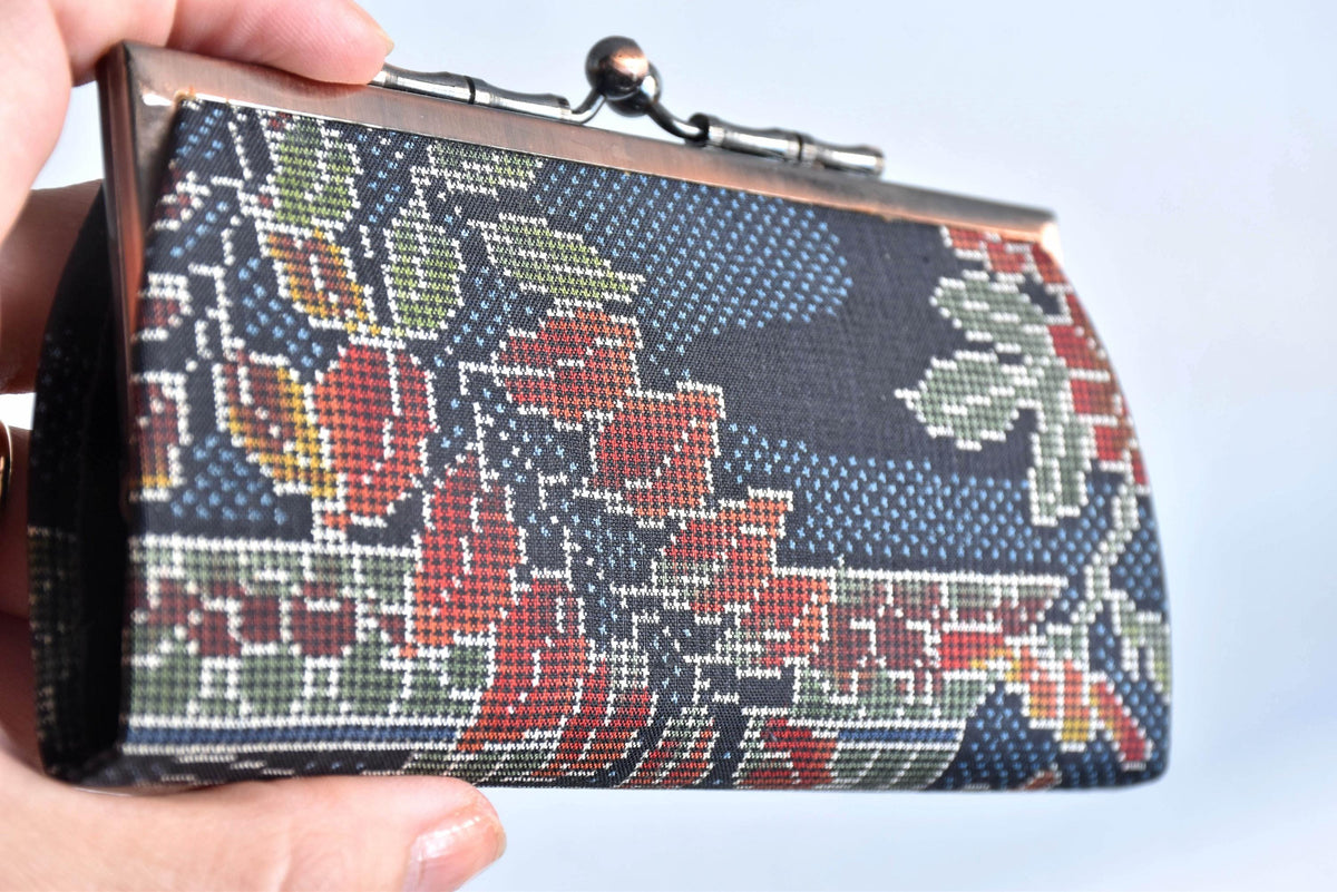 Blue Oshima Tsumugi Silk Gamaguchi Coin Purse angle view showing patterned fabric and clasp