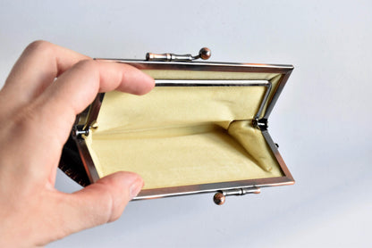 Blue Oshima Tsumugi Silk Gamaguchi Coin Purse open interior viewed from above with metal frame