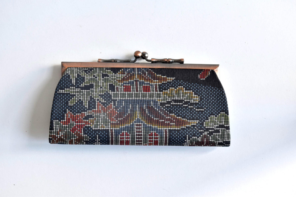 Blue Oshima Tsumugi Silk Gamaguchi Coin Purse front view displaying traditional textile pattern