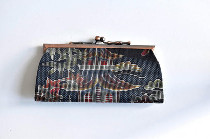 Blue Oshima Tsumugi Silk Gamaguchi Coin Purse front view displaying traditional textile pattern