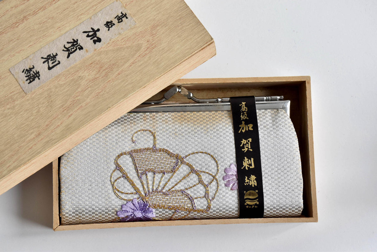 Kaga Embroidery Silk Clutch Purse With Silver Kiss-Lock inside a wooden box
