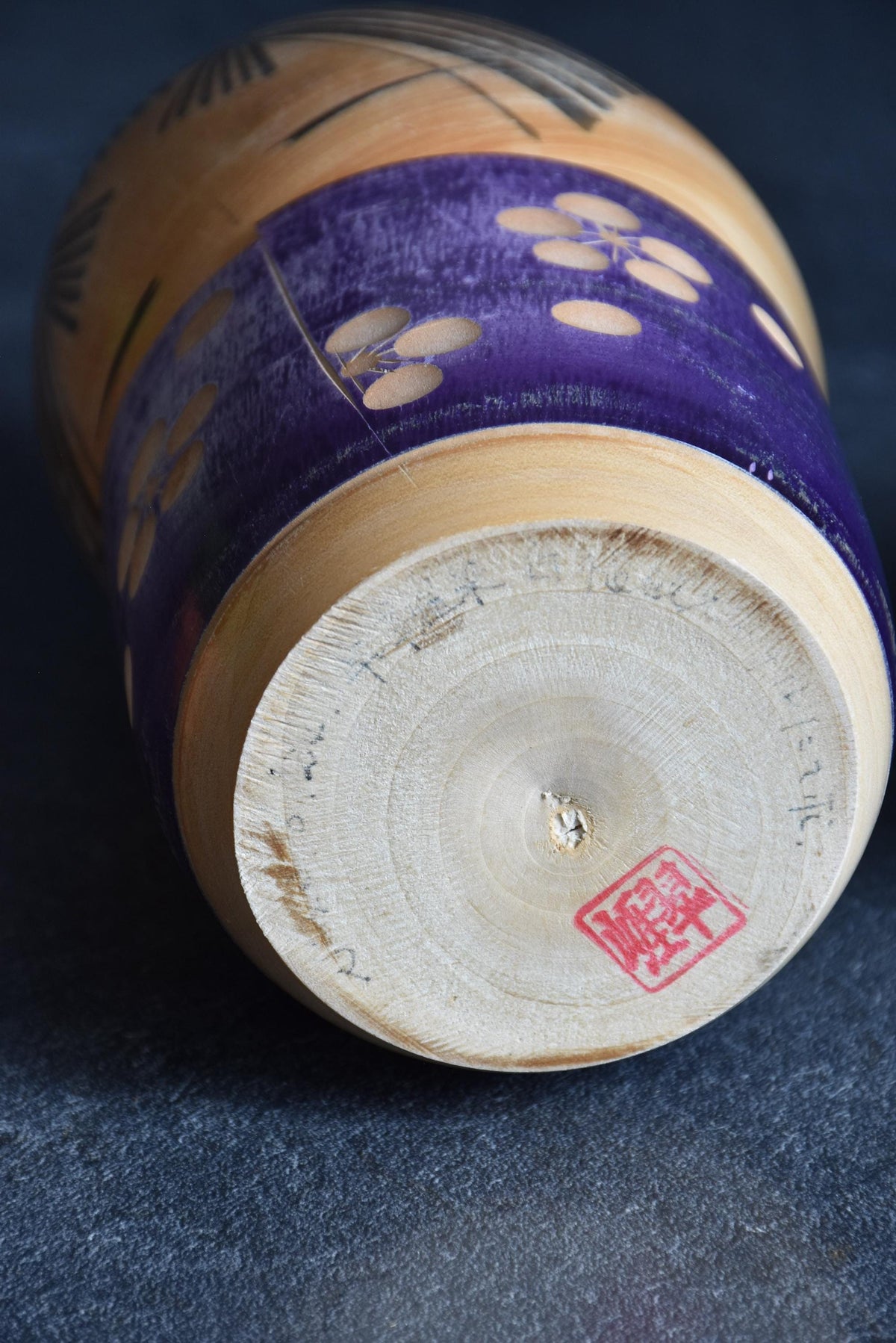 Sato Suigai kokeshi showing the base with artist signature and hanko seal