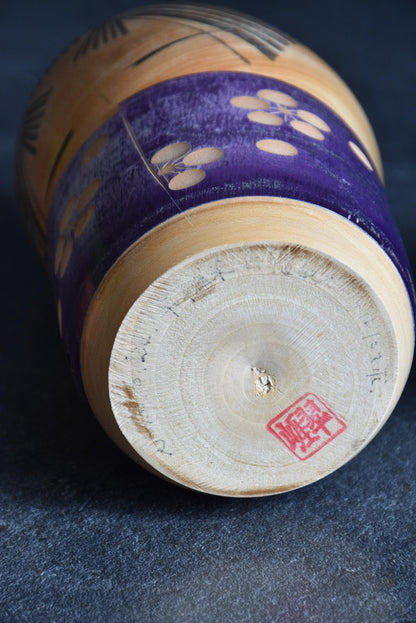Sato Suigai kokeshi showing the base with artist signature and hanko seal