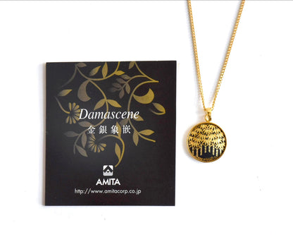 Amita Damascene Zogan Necklace Bamboo Motif with accompanying informational product leaflet