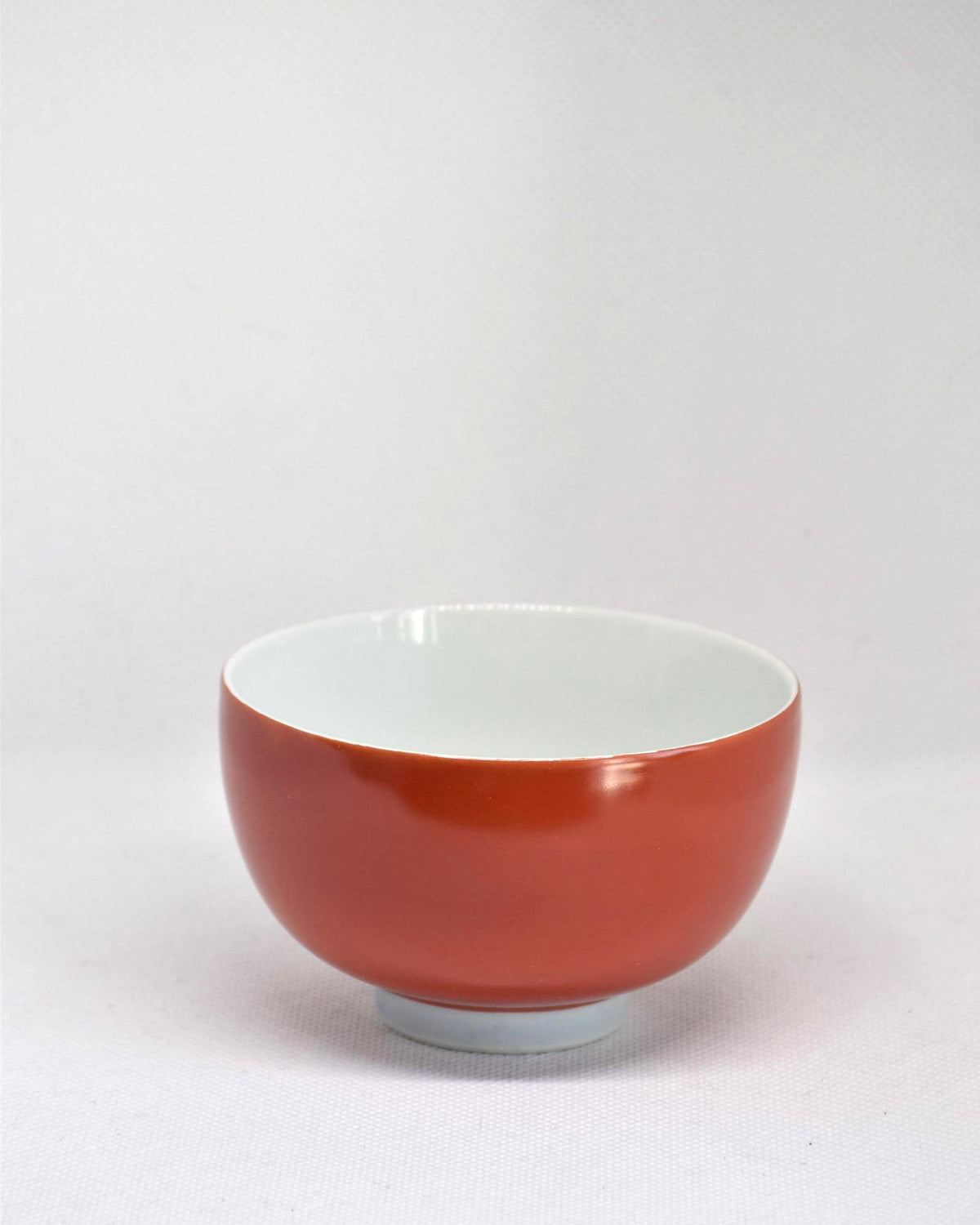 Koransha tea cup set featuring a single vermilion glazed porcelain bowl viewed from the front