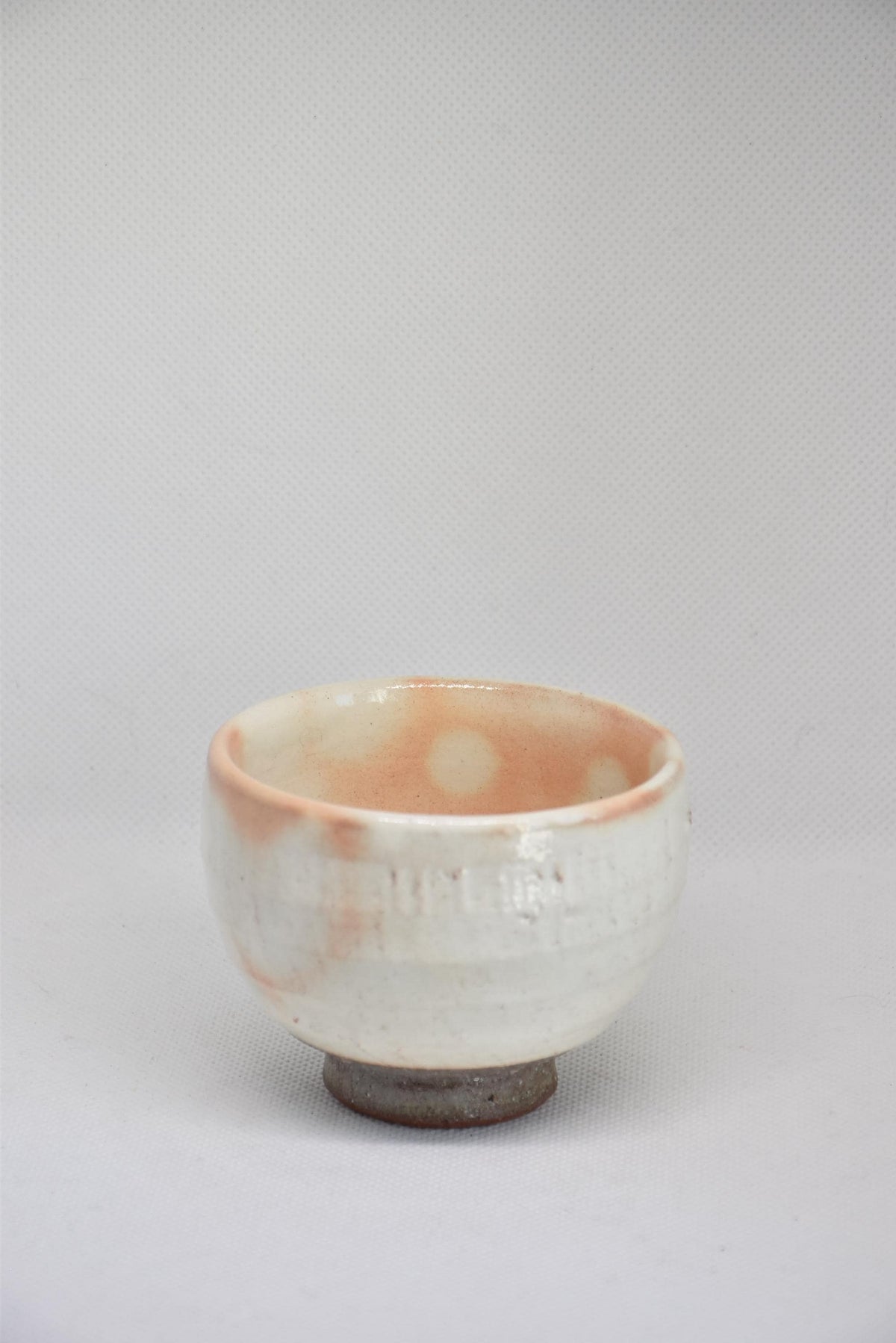 Set Of 5 White Kumidashi Teacups individual cup front view highlighting the textured ceramic surface