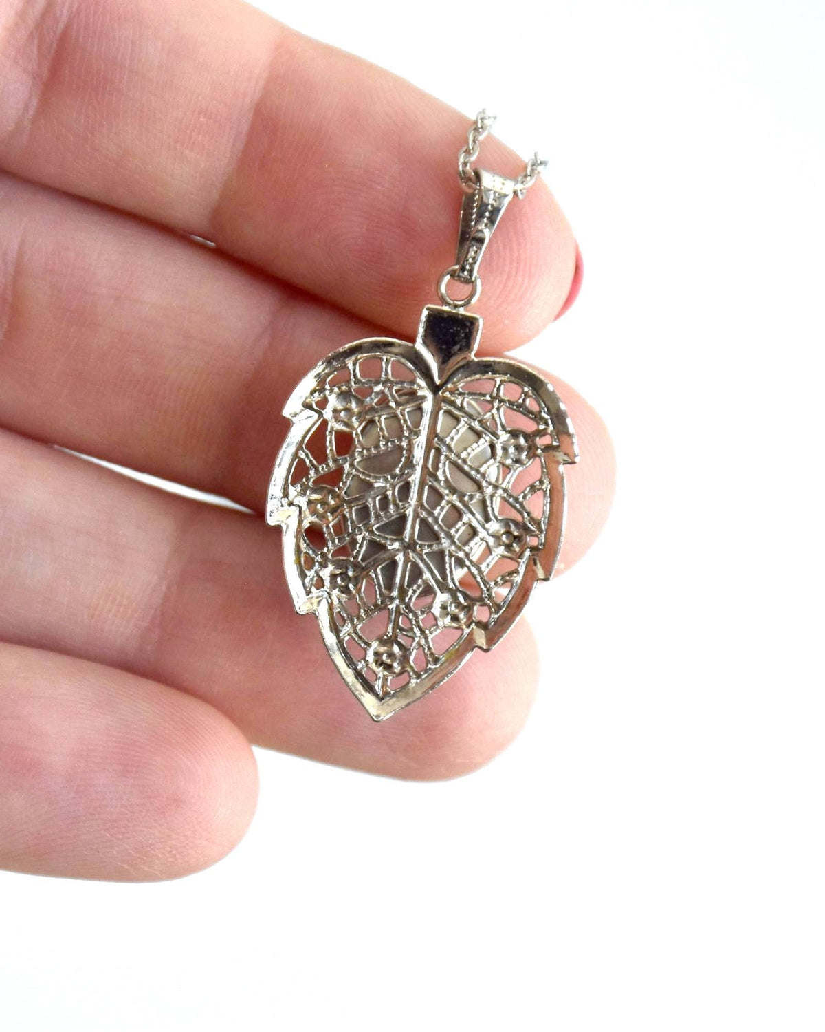 Okagaki Kōtoku vintage necklace pendant back showing filigree leaf frame construction