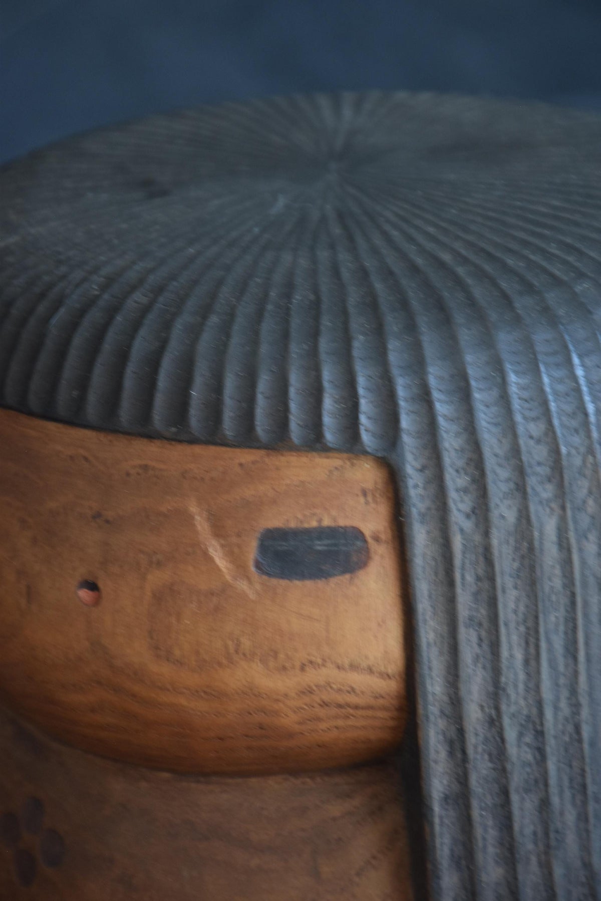 Sanpei Yamanaka kokeshi face detail showing nick near eye and tiny red lip dab