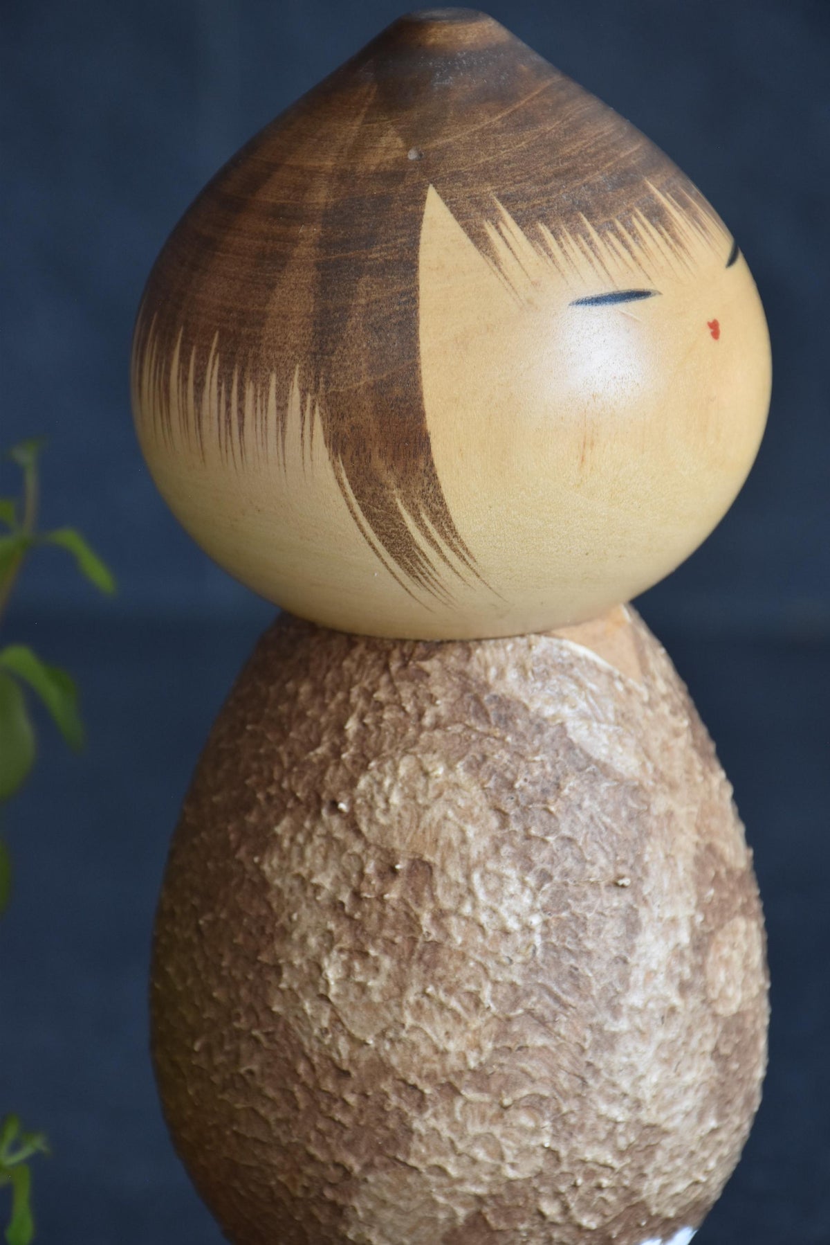 Masao Watanabe Sosaku Kokeshi Doll Mushin side profile showing painted face and textured torso