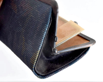 Blue Oshima Tsumugi Silk Gamaguchi Coin Purse shown open to reveal the light brown interior lining and pockets.