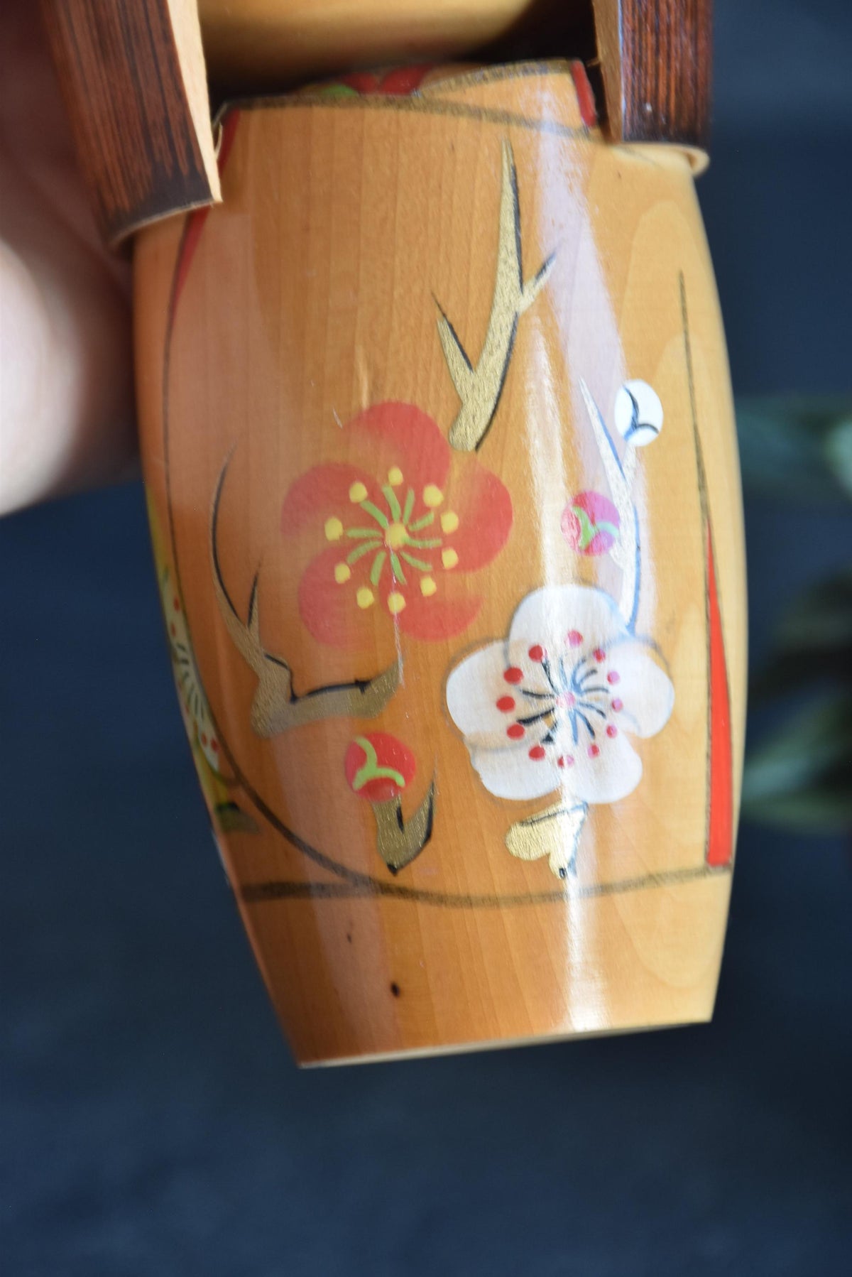Kojo Tanaka Sosaku Kokeshi doll pattern detail showing hand-painted plum blossoms