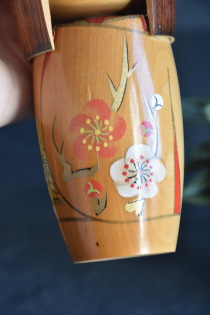 Kojo Tanaka Sosaku Kokeshi doll pattern detail showing hand-painted plum blossoms