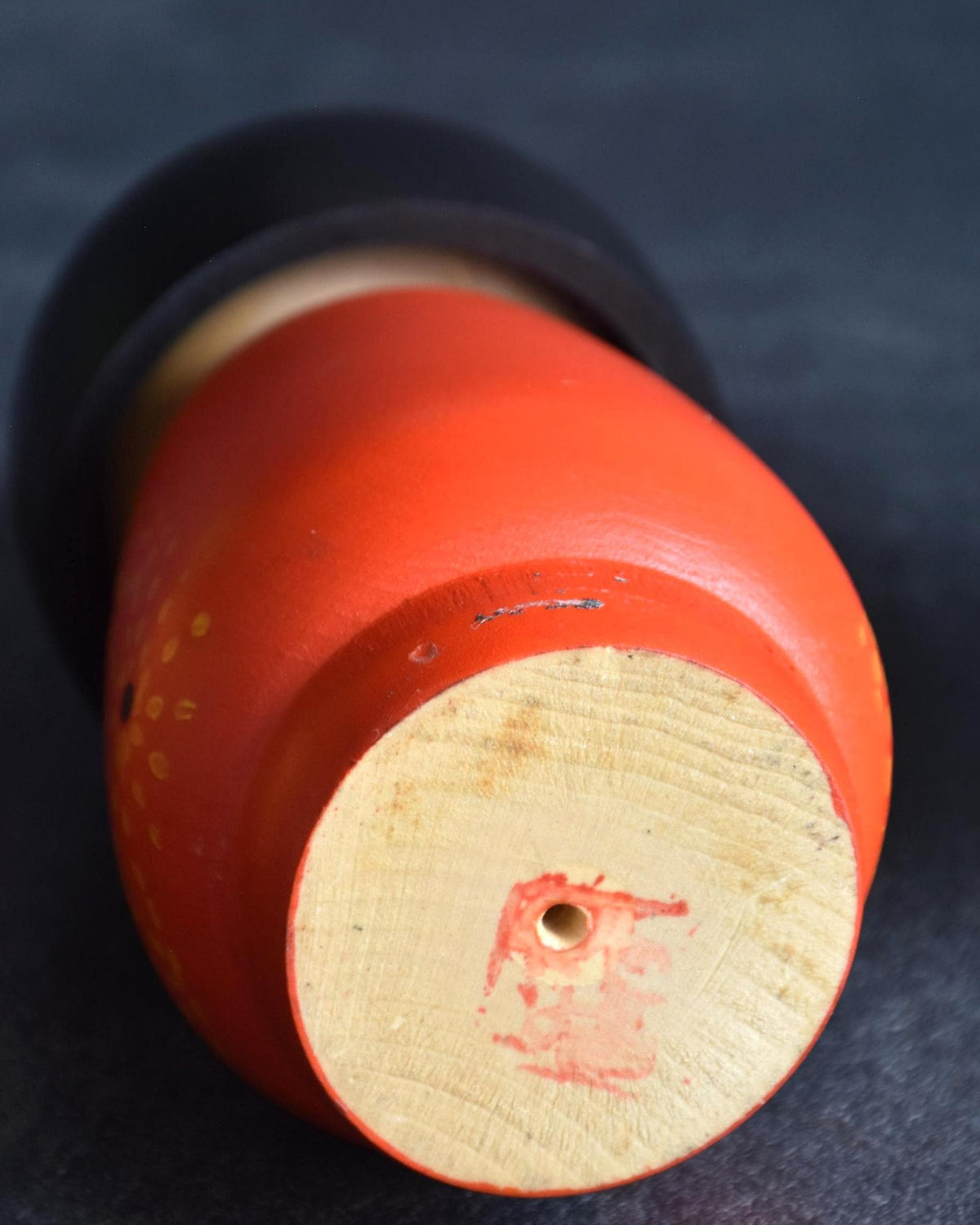 Kazuo Takamizawa kokeshi doll base, showing the artist red hanko signature stamp on turned wood