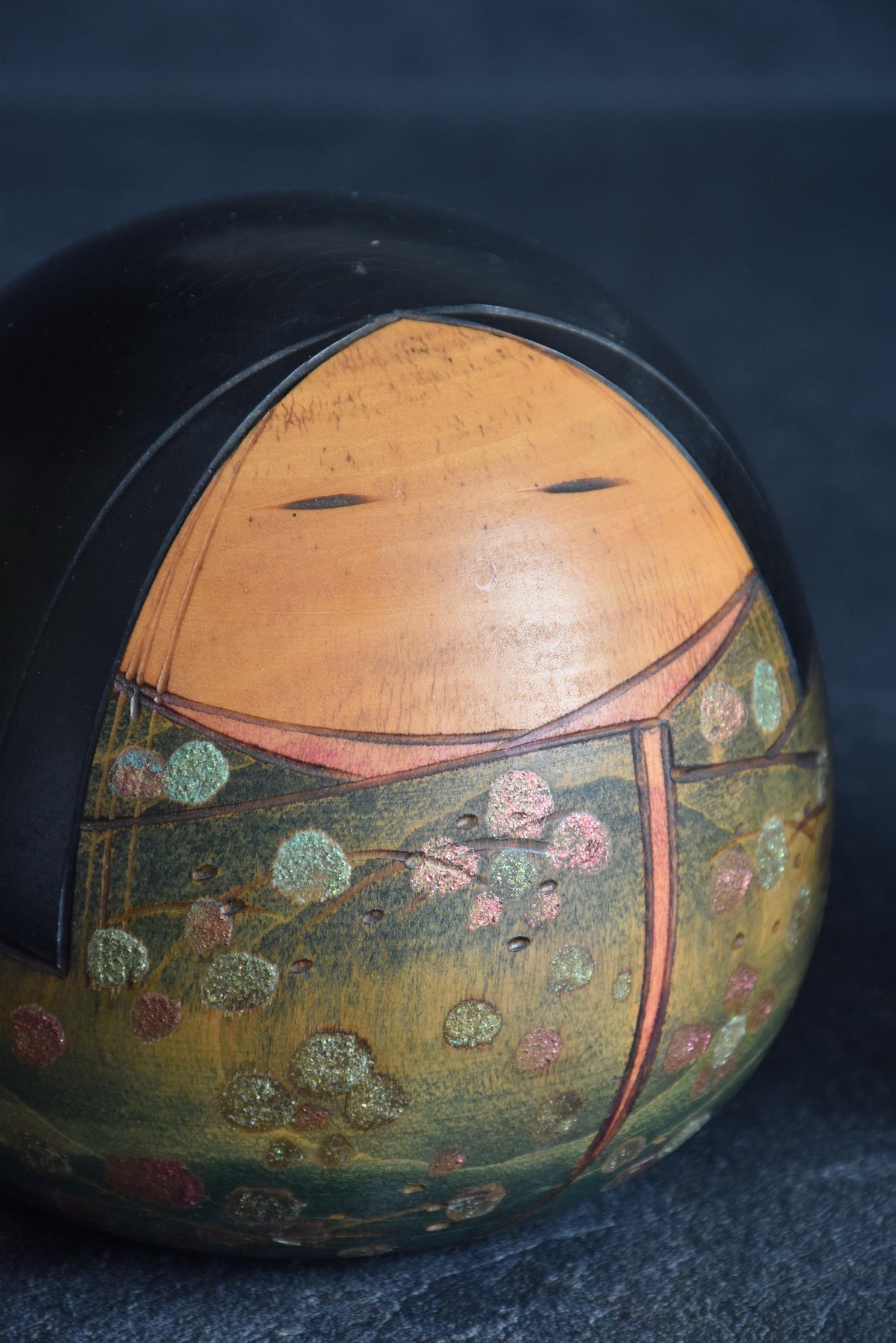 Toa Sekiguchi Sosaku Kokeshi Doll close-up of the natural wood face and delicate painted features