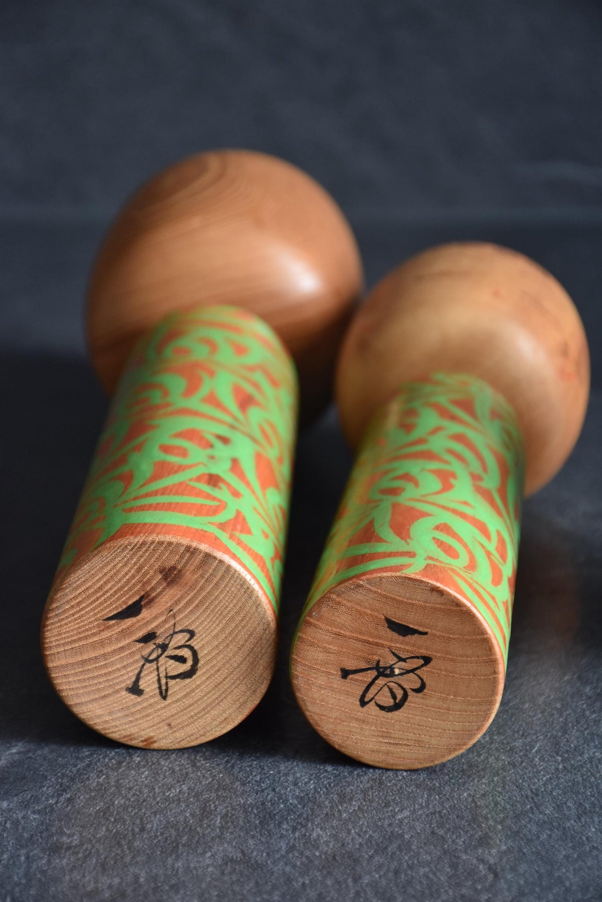 Issetsu Kuribayashi sosaku kokeshi pair Mugen Arabesque bases with artisan signatures