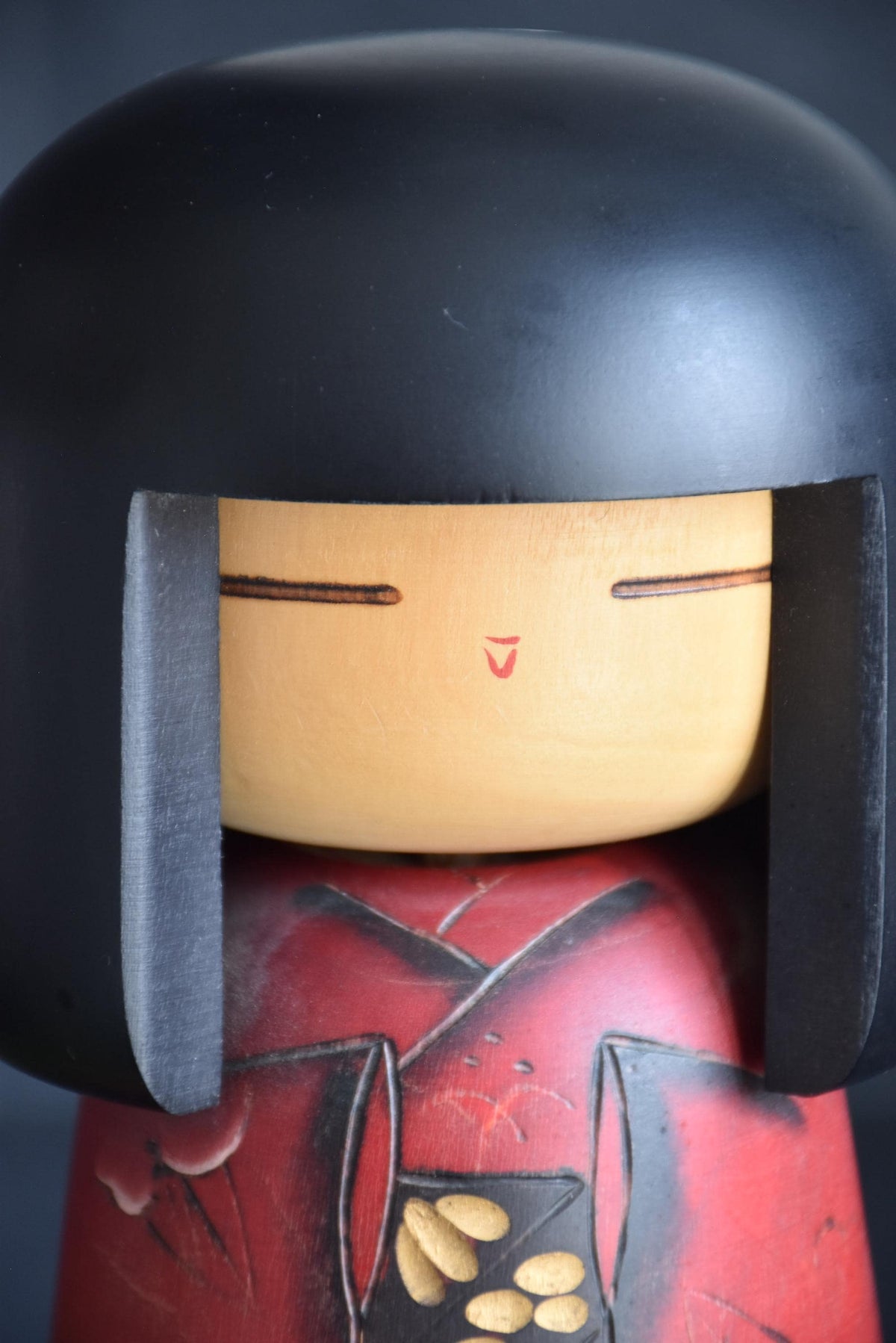 Masae Fujikawa kokeshi doll close-up of the serene minimalist face and black bob hairstyle