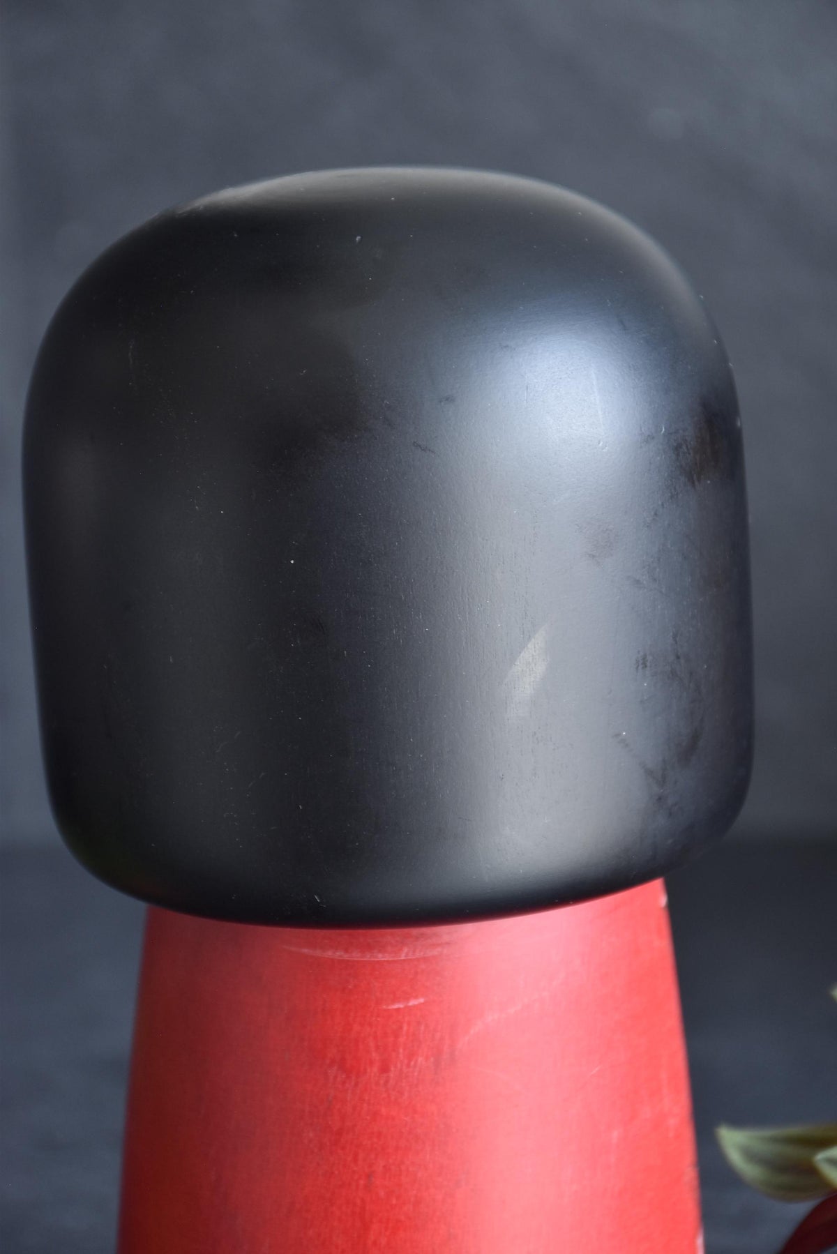 Masae Fujikawa kokeshi doll close-up of the black bob hairstyle showing surface wear