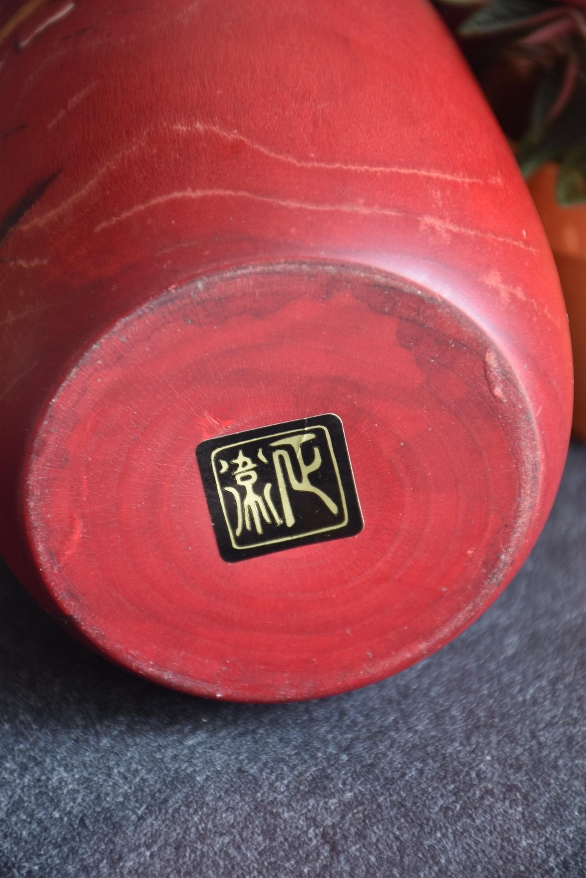 Masae Fujikawa kokeshi doll base showing the artisan signature stamp and wood grain