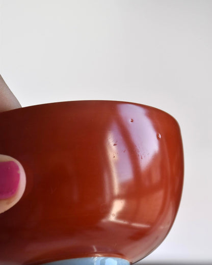 Koransha tea cup set showing another angle of a single red and white porcelain tea bowl